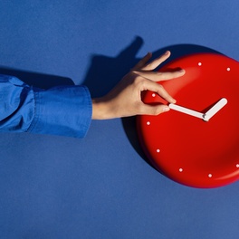 hand-holding-wall-clock-still-life.jpg