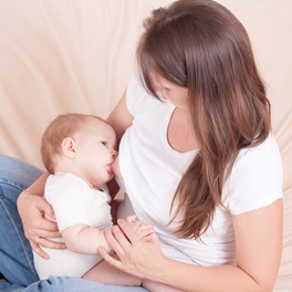 young-woman-feeds-baby-s-chest-s.jpg