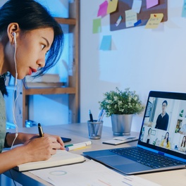 asia-businesswoman-using-laptop-talk-colleagues-about-plan-video-call-meeting-living-room.jpg