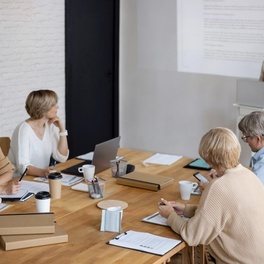 medium-shot-woman-leading-business-meeting.jpg