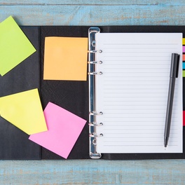 notebook-pen-blue-wood-table.jpg