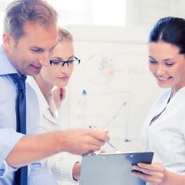 smiling-business-team-discussing-something-office.jpg
