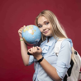 blonde-student-woman-holds-globe.jpg