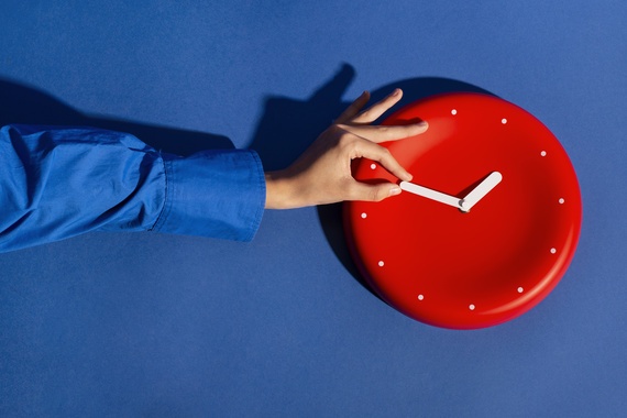 hand-holding-wall-clock-still-life.jpg