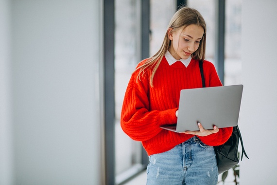 girl-student-with-laptop-standin.jpg
